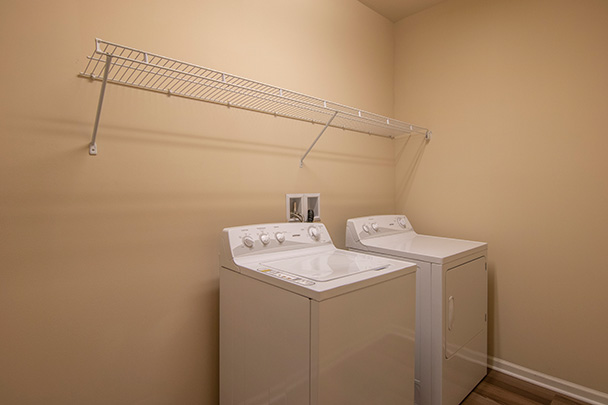 a white washer and dryer in a laundry room