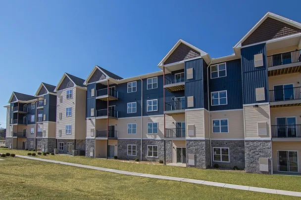 a large apartment building with lots of windows and balconies