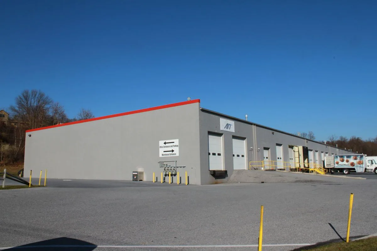 A Building with a Sign on the Side That Says "Warehouse"