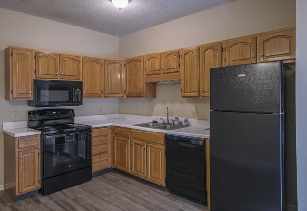 A Kitchen with a Black Refrigerator