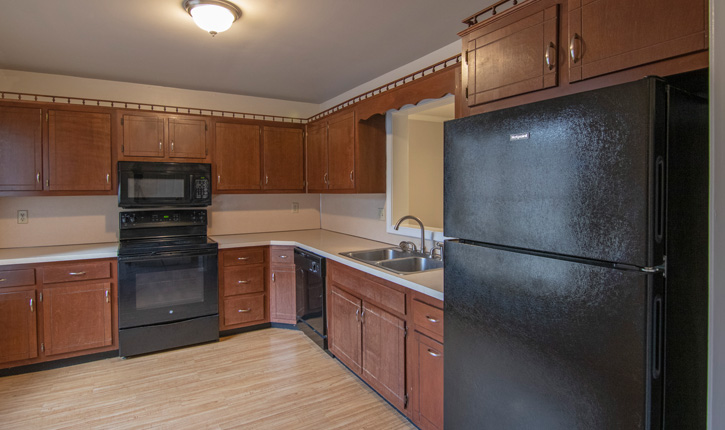 A Kitchen with a Black Refrigerator