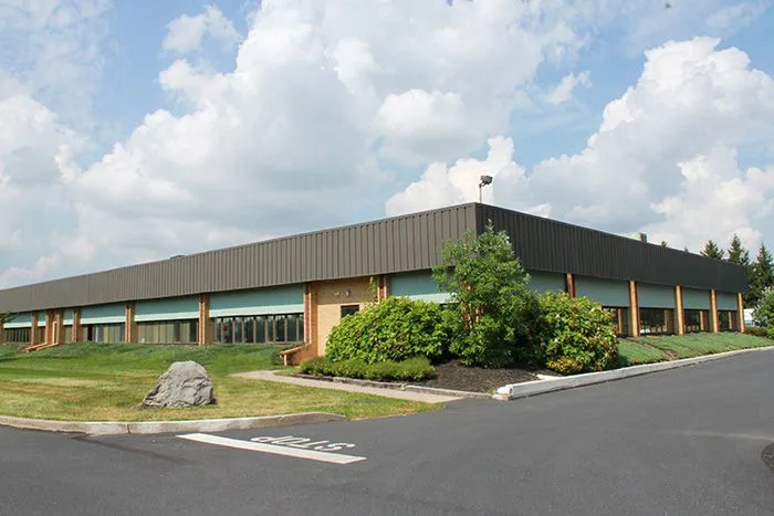 A Large Building with Beautiful Greenery