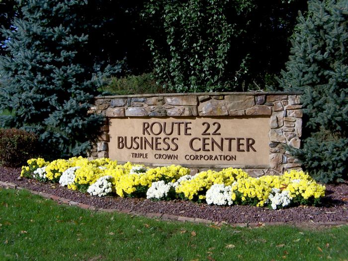 a stone sign for route 22 business center triple crown corporation