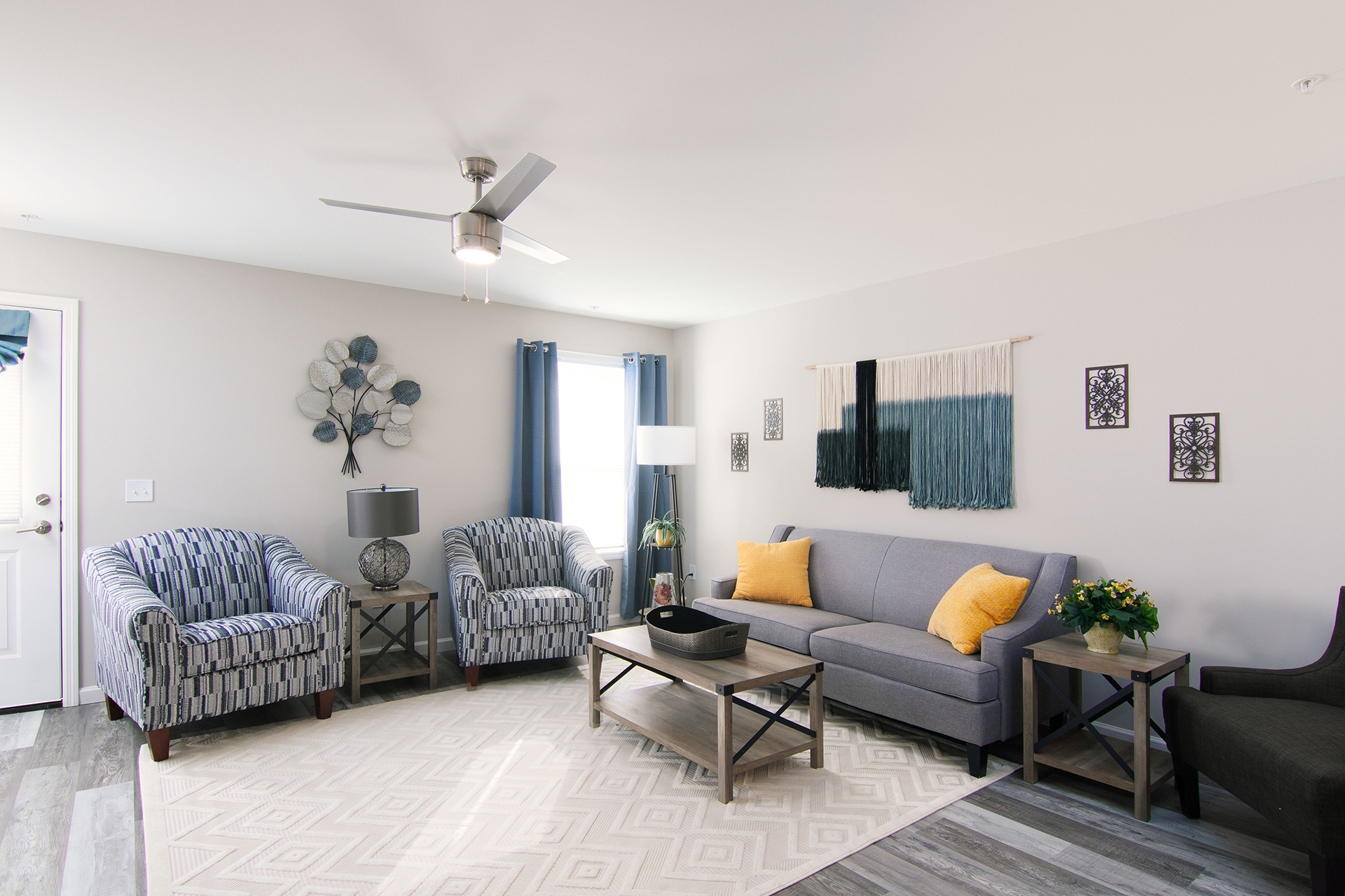 a living room with a couch and two chairs