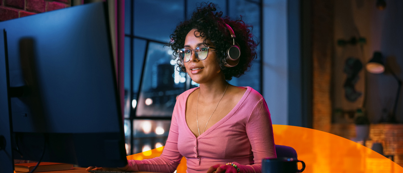 A Woman Sitting in Her Apartment Working on a Computer